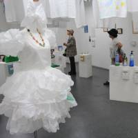 Afterlife: Visitors take a look at artworks made from recycled commodities at kimura ASK? art gallery in Chuo Ward, Tokyo, on Wednesday. | KYODO