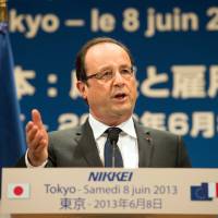 Brothers in arms: French President Francois Hollande delivers a speech at a gathering in Tokyo on Saturday. | AFP-JIJI