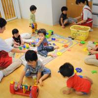 While moms work: Children of Shiseido Co. employees play Friday in the Kangaroom day care facility in its head office in Minato Ward, Tokyo. | SATOKO KAWASAKI