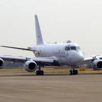 Wings clipped: A Maritime Self-Defense Force P-1 patrol plane is parked in March at the Atsugi base, Kanagawa Prefecture. | KYODO