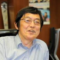 Reeling \'em in: Japan Tourism Agency chief Norifumi Ide is interviewed at his office in Tokyo. | SATOKO KAWASAKI
