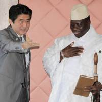 Making new friends: Prime Minister Shinzo Abe meets Gambian President Yahya Jammeh during a bilateral meeting held on the sidelines of the Tokyo International Conference on African Development in Yokohama on Sunday.  | AP
