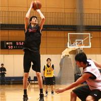 Stepping up: Yuta Watanabe, working on his jump shot at the Ajinomoto National Training Center, plans to attend a Connecticut preparatory school before aiming to land a spot on an NCAA Division I men\'s basketball team. | KAZ NAGATSUKA