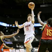 Staying aggressive: Japan guard Yuko Oga drives to the basket on Friday night against Mozambique at Sendai\'s Xebio Arena. The Japan women\'s national team whipped Mozambique 105-39 in the first of three games between the clubs through Sunday. | KYODO