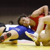 Locked up: Kaori Icho (right) competes in the women\'s 63-kg competition at the All-Japan Invitational Championships in Tokyo on Sunday. | KYODO