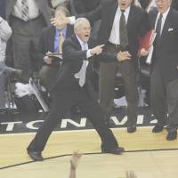 Family ties: Herb Brown (right), has often been overshadowed by younger brother Larry (center), seen here while both worked for the Charlotte Bobcats in 2009. | AP