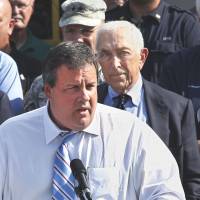 Final act: Democratic New Jersey Sen. Frank Lautenberg (right) listens as state Gov. Chris Christie addresses a gathering in Lincoln Park, New Jersey, in August 2011. | AP