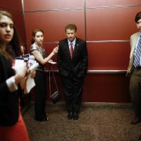 G-Rand ambitions?: Kentucky Sen. Rand Paul rides in an elevator with reporters and staff members after speaking at the Faith and Freedom Coalition Road to Majority Conference in Washington on June 13. | AP