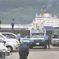 Dangerous load: Policemen provide security Thursday as a ship from France arrives bringing reprocessed nuclear fuel for Kansai Electric Power Co.\'s nearby Takahama nuclear plant. | AFP-JIJI