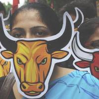 \"Strangling the beast from the inside\": Protesters rally in Kolkata on Saturday to demonstrate against the local government and its policies, as well as local law and order problems. | AFP-JIJI