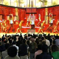 Computer-generated images are projected on the wall of a former dockyard in Yokohama on Monday for a press preview of \"Yokohama Odyssey,\" a depiction of the city\'s history. The event, which runs till Sept. 1, celebrates the 20th anniversary of the redevelopment of the waterfront area. | KYODO