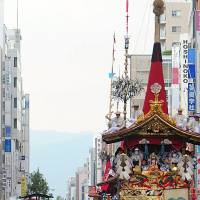 The highlight of the Gion Festival, \"Yamahoko\" floats are paraded through the streets of Kyoto on Wednesday. The annual monthlong festival runs through July 31. | KYODO