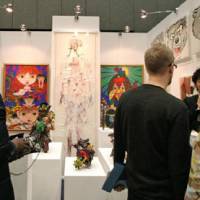 Walking, gawking, shopping: Tokyo\'s Nanzuka Underground at the 2007 Art Fair Tokyo; Below: Visitors to 101TOKYO 2008 peruse galleries\' booths in Akihabara. | &#169; ART FAIR TOKYO/ 101TOKYO (below)