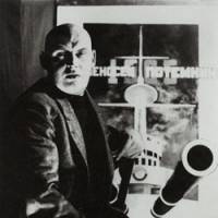 Designer couple: Alexsandr Rodchenko (above) with his poster for the film \"Battleship Potemkin,\" and Varvara Stepanova in a dress made from fabric printed with her textile design. | THE STATE PUSHKIN MUSEUM / PRIVATE COLLECTION