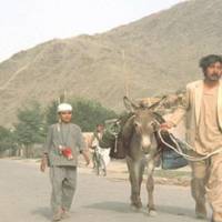 Portrait of the documentarian: Actor Rentaro Mikuni walks with an Afghan boy, who he knew only as Nabi, in a scene from his uncompleted 1972 film \"Kishi no nai kawa\" (The Endless Stream). | LAURENT THURIN-NAL / TORI ITO / NON TAKAGI/ WILLIAM ANDREWS