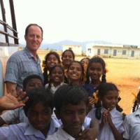 Warm welcome: The author with village kids drawn to the outsider on their patch. | KAHO MIYAMOTO PHOTOS