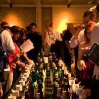 Just a taste: Visitors choose sakes to taste from a table filled with different varieties at The Joy of Sake San Francisco. To celebrate its 10th anniversary, The Joy of Sake comes to Japan on Nov. 2, and includes 329 premium brews from 166 producers across the country. | THE JOY OF SAKE