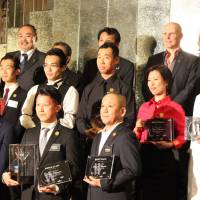 Winner of the Diageo World Class Japan Final Tsuyoshi Miyazaki stands front, center, surrounded by other prize winners at the national cocktail competition. | DRINK PLANET