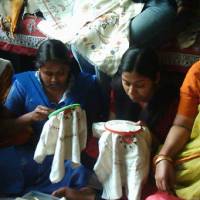 Fine work: Young women sew products at the Kantha Job Training Center in Kolkata, India, in January 2007 Embroidery center gives women fabric for a future
