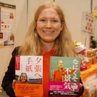 Word of advice: Entrepreneur Natalia Roschina proudly displays the two books she penned on how to resolve the Japanese recession. | KARRYN MILLER PHOTO