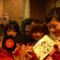 Wall of sound: 45s in their `60s glory on display at Be-in Records in Koenji, Tokyo (top), which is a a trove of early vinyl rarities. The Feminine (above, with gorilla), a hard-drinkin\' garage-rock trio from Saitama, with their debut 7-inch single \"Sweet Stout Boogie\" | DAVID HICKEY PHOTO