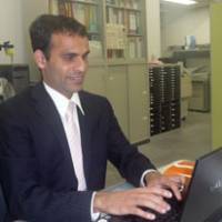 Disability research: Nepalese Kamal Lamichhane, a postgraduate research student, works at his “alternate eye,” his computer at a Tokyo University research center. Nepalese 'VIP' advocates investing in disability