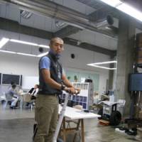 Corporate mover: Dai Akimoto, director of marketing at Segway Japan, on a Segway in his Yokohama office | EDAN CORKILL