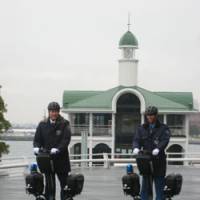Riding high: Security guards on Segways at Pacifico Yokohama convention center, where the machines are standard issue. | PACIFICO YOKOHAMA