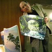 Pushing the boundaries: Brian Williams poses with two of his parabolic paintings. | TOMOKO OTAKE PHOTO