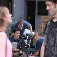 Straight to Web: Anthony Gilmore (holding papers) directs the crew during the filming of \"English Teachers\" in Nagoya. | AP PHOTO