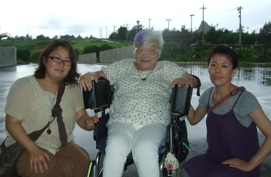 Visionary: Hiroko Kimura is flanked by the staff of Tsuchi no Yado, the inn she established on Iejima island in Okinawa Prefecture that aims to facilitate understanding between able-bodied and disabled people. | JON MITCHELL