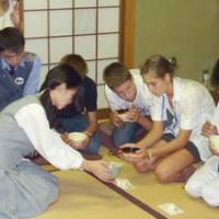 Hands-on: Foreign students learning Japanese take part in a tea ceremony lesson at Toko Gakuen in Kawasaki on Sept. 15, while students from Sri Lanka and Hungary (above) are given lessons in Japanese archery at the school, both as part of a nine-day exchange visit in Japan. | MAMI MARUKO PHOTO