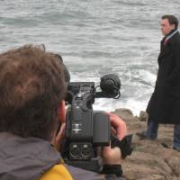 Suicide spot:  Marc-Antoine Astier (using camera) and Rene Duignan shoot a scene for their film \"Saving 10,000 &#8212; Winning a  War on Suicide in Japan\" at  Tojinbo in Sakai, Fukui, where hundreds of Japanese choose to end their lives. | COURTESY OF RENE DUIGNAN