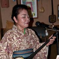 Oshiro sings an Okinawan folk song. | STEPHEN MANSFIELD