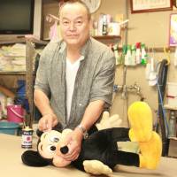 Mice work: Sadaharu Yoshinaga restores Disney\'s famed rodent to sparkling life in his Miyazaki City workshop. | EDAN CORKILL PHOTO