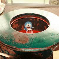 A plush toy is spun dry as it\'s restored to its original condition. | EDAN CORKILL PHOTO