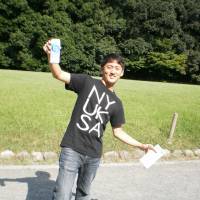 Last holiday: Scott Kang poses in an unknown location in Japan in a picture taken on his camera days before a fatal incident in a stairwell in Shinjuku in August 2010. | COURTESY OF KANG FAMILY
