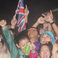 Aural action: Music lovers lap it up in a moshpit at Fuji Rock Festival. This year saw a lot of rain on Friday, which was compensated for by some sublime performances from the likes of Lily Allen, Patti Smith and Oasis, while on Saturday and Sunday the sun did shine. | ROB SCHWARTZ