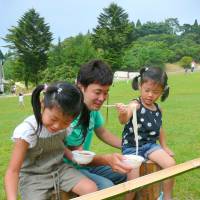 Lunchtime: Children enjoy some cold noodles in the summer. | FELLERS FILM LLC 2012 ALL RIGHTS RESERVED