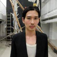 Eiji Hatanaka, project producer of Tabloid\'s opening party, pictured with artwork that was created during the event. | RYO TANIKAWA
