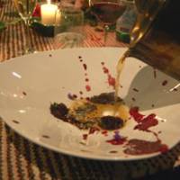 Illustrated food chain: For September\'s Cook it Raw event in Lapland, Finland, Yoshihiro Narisawa created a bear, grouse and rabbit consomme, which he poured over strips of wild hare served with a sauce of lingonberry and blueberry. | MELINDA JOE PHOTO