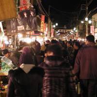 Roll up, roll up: Crowds promenade between the lines of around 750 stalls at the annual Boroichi market | MARK SCHREIBER PHOTO