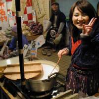 Vendors sell cups of hot, sweet amazake | MARK SCHREIBER PHOTO