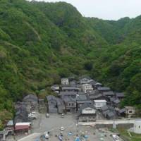 Though it is Japan\'s fifth- largest island, Sado\'s rugged terrain dictates that many of its small fishing communities, like this one on the south coast (above), are to be found crammed into tiny valleys between steep, forested hillsides. Inland, however, its rural landscapes are a delightful mix of low hills, rice farms and orchards (below). During the island\'s annual Earth Celebration festival, coming up from Aug. 16-18, many new converts are sure to be made to Sado\'s unique charms. | ROB SCHWARTZ
