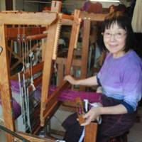 Happy work: Weaver Kazuko Teraoka sits at the hand loom in her atelier/shop, Kazu. | JAN-WILLEM PAIJENS PHOTOS