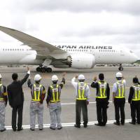 Off for Finland: Japan Airlines employees see off JAL\'s first Boeing 787 flight to Helsinki at Narita airport in Chiba Prefecture on Monday. | KYODO