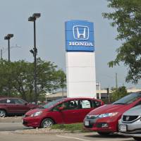 Ready to play in Peoria: Honda vehicles sit outside Bob Lindsay Honda in Peoria, Illinois, on June 25. Honda seeks to make cars pedestrian-safer