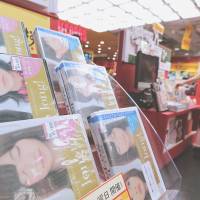 Special offer: DVDs of girl idol group AKB48 are on sale Monday at the Tower Records store in Tokyo. | BLOOMBERG