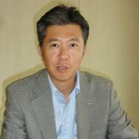 Slaking a thirst: Nobuhiro Torii, president of Suntory Beverage &amp; Food Ltd., is interviewed Friday. | KYODO