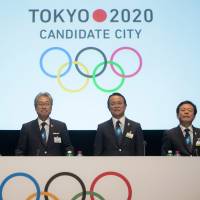 Game on: Key promoters of Tokyo\'s 2020 Olympics bid (from center to right) Japanese Olympic Committee President Tsunekazu Takeda, Deputy Prime Minister and Finance Minister Taro Aso and Tokyo Gov. Naoki Inose make a presentation Wednesday during the first day of the International Olympic Committee\'s extraordinary session in Lausanne, Switzerland. | AP